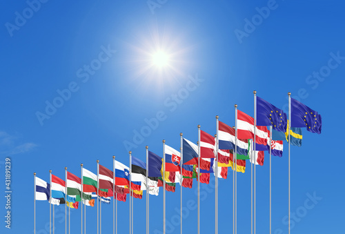 27 waving flags of countries of European Union (EU). Blue sky background. 3D illustration.
