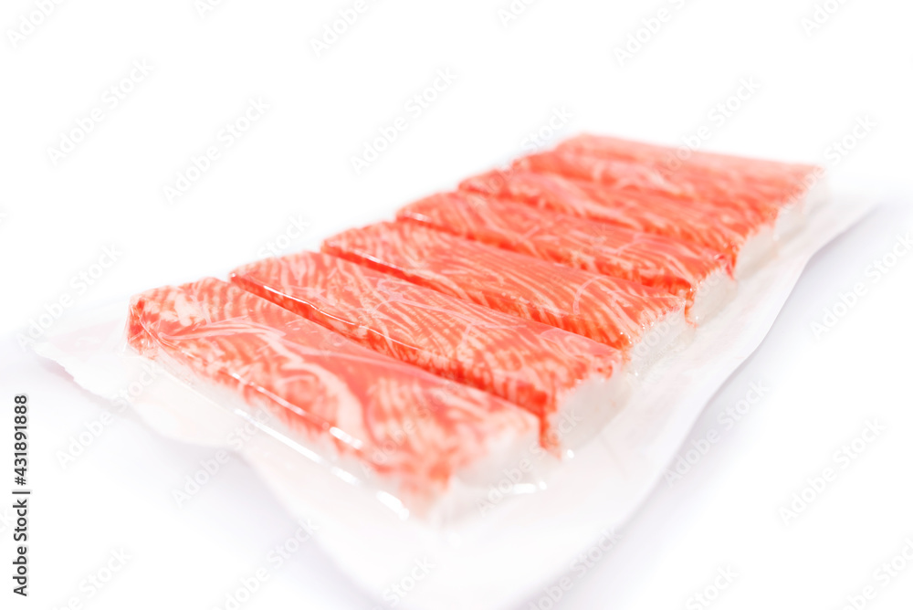 crab sticks in packaging on a white background. crab sticks in packaging on a white background.
