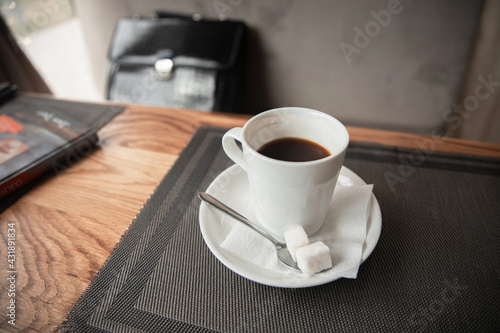 a cup of coffee on a table in a cafe