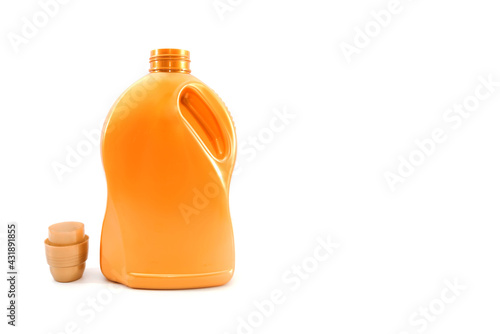 detergent in an orange bottle isolated on a white background. photo