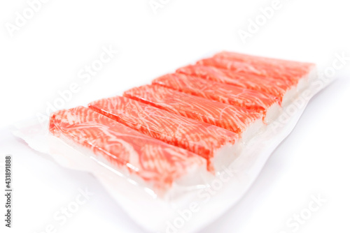 crab sticks in packaging on a white background.