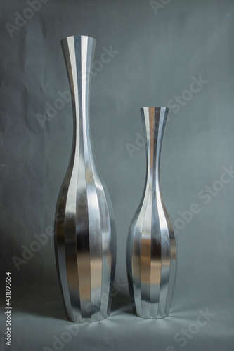 Decorative vases on a gray background.
