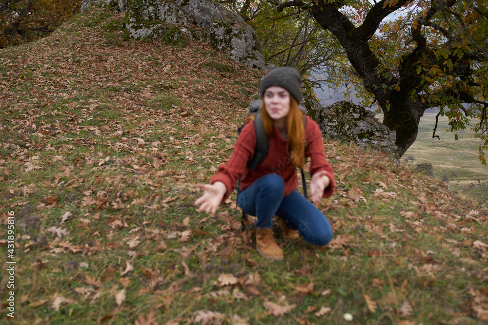 woman tourist with backpack in autumn forest travel nature woman tourist with backpack in autumn forest travel nature