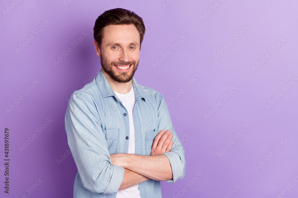 Photo of attractive cheerful young woman hold hands folded smile isolated on violet color background Photo of attractive cheerful young woman hold hands folded smile isolated on violet color background