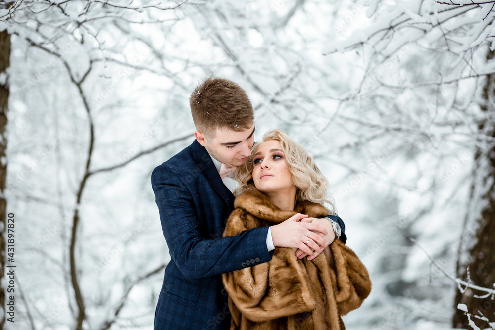 winter wedding lovestory. a couple in love on a walk in winter winter wedding lovestory. a couple in love on a walk in winter
