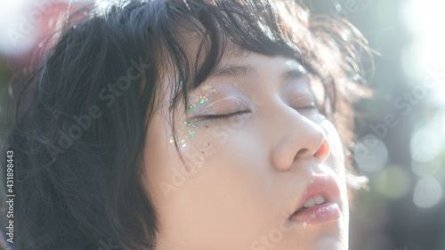 Photos Closeup portrait of young adult asian woman glossy glitter style makeup