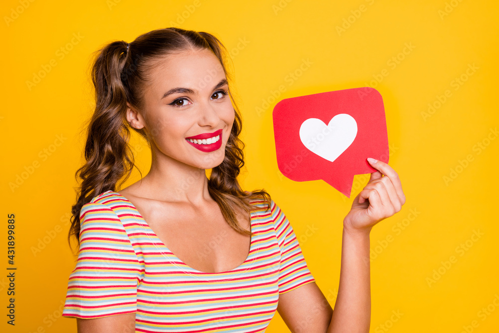 Photo of young lovely pretty sweet smiling cheerful happy good mood girl show like icon isolated on yellow color background Photo of young lovely pretty sweet smiling cheerful happy good mood girl show like icon isolated on yellow color background