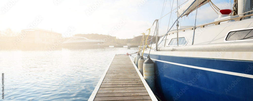 Φωτογραφία Elegant and modern sailing boats (for rent) moored to a pier in a yacht marina on a clear day