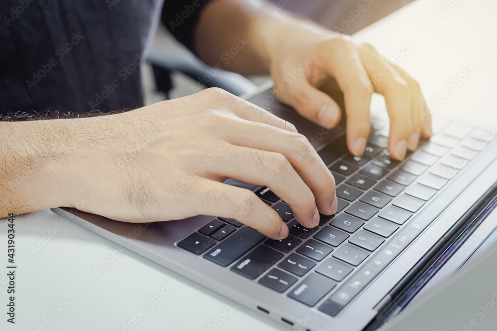 Close-up Man is using laptop to work at home , Business finance concept Close-up Man is using laptop to work at home , Business finance concept