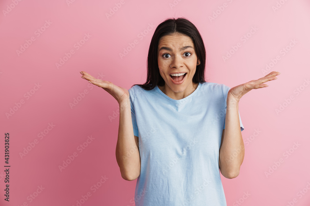 Excited hispanic woman holding copyspace and smiling at camera Excited hispanic woman holding copyspace and smiling at camera