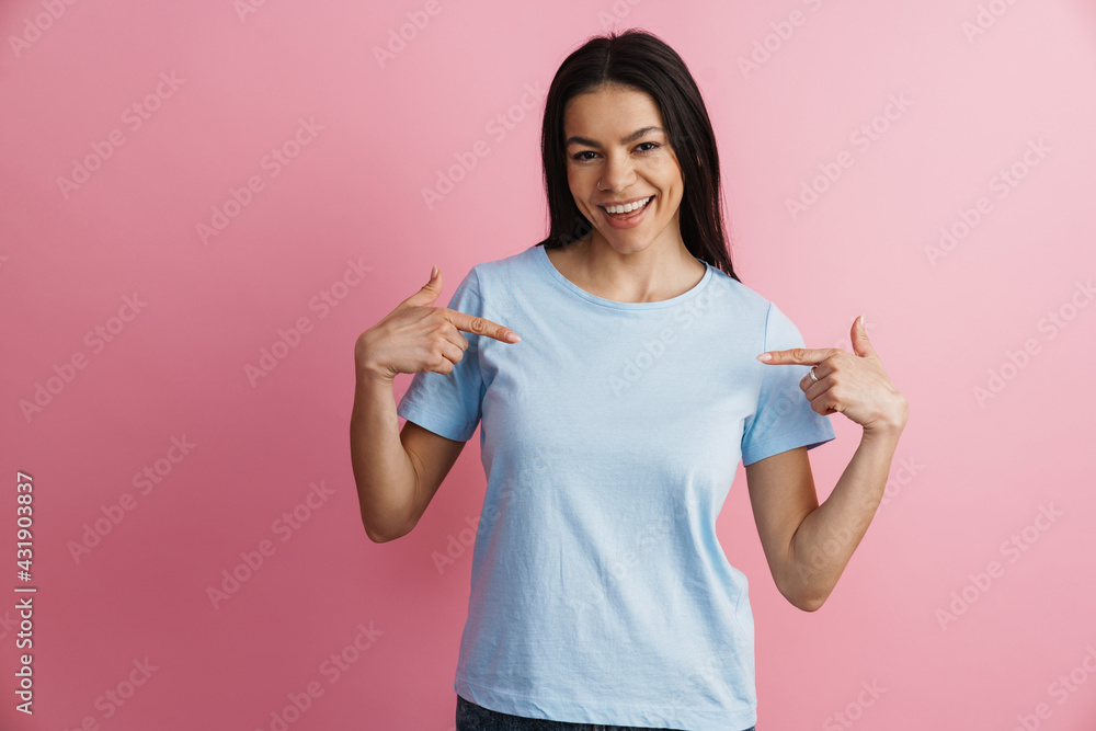 Excited hispanic woman smiling and pointing fingers at herself Excited hispanic woman smiling and pointing fingers at herself