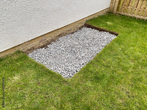 House garden grass turf cut for ground preparation to allow stone sub base to be laid