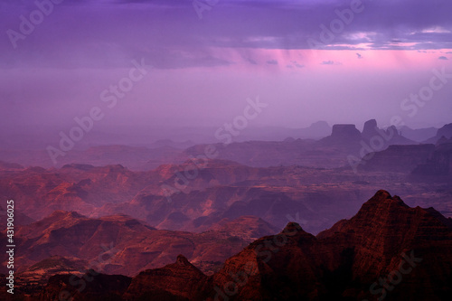 Ethiopia landscape  twilight sunset in the rock in Simien Mountains NP  Ethiopia. Big hills in Africa. Pink landscape with hills and valleys with dark clouds.  Magic evening in nature.