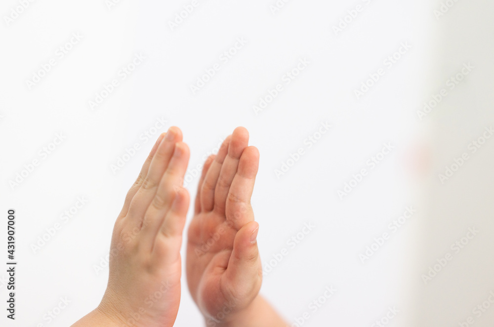 kids hands high five on white background closed up with co operation concept kids hands high five on white background closed up with co operation concept