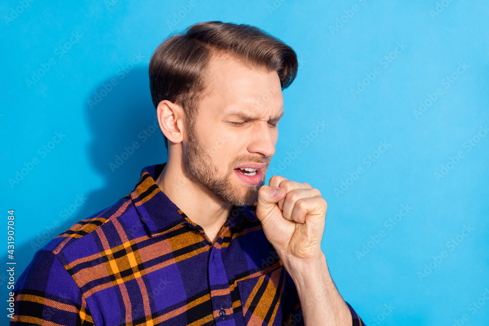 Photo of unhappy upset young man cough ill infection cold symptoms isolated on pastel blue color background Photo of unhappy upset young man cough ill infection cold symptoms isolated on pastel blue color background