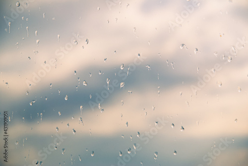 Raindrops on the window, sky on the background