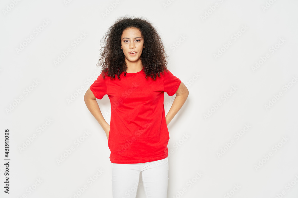 woman with curly hair red tshirt casual wear studio emotion