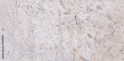 Dolomite natural stone texture. Stone with beige pattern on a smooth surface.