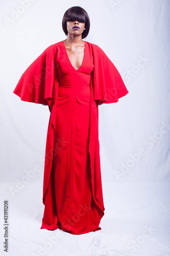 Beautiful African fashion model dressed in red gown