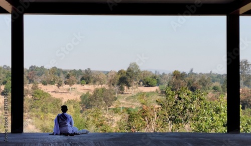 person sitting on a floor with natural views