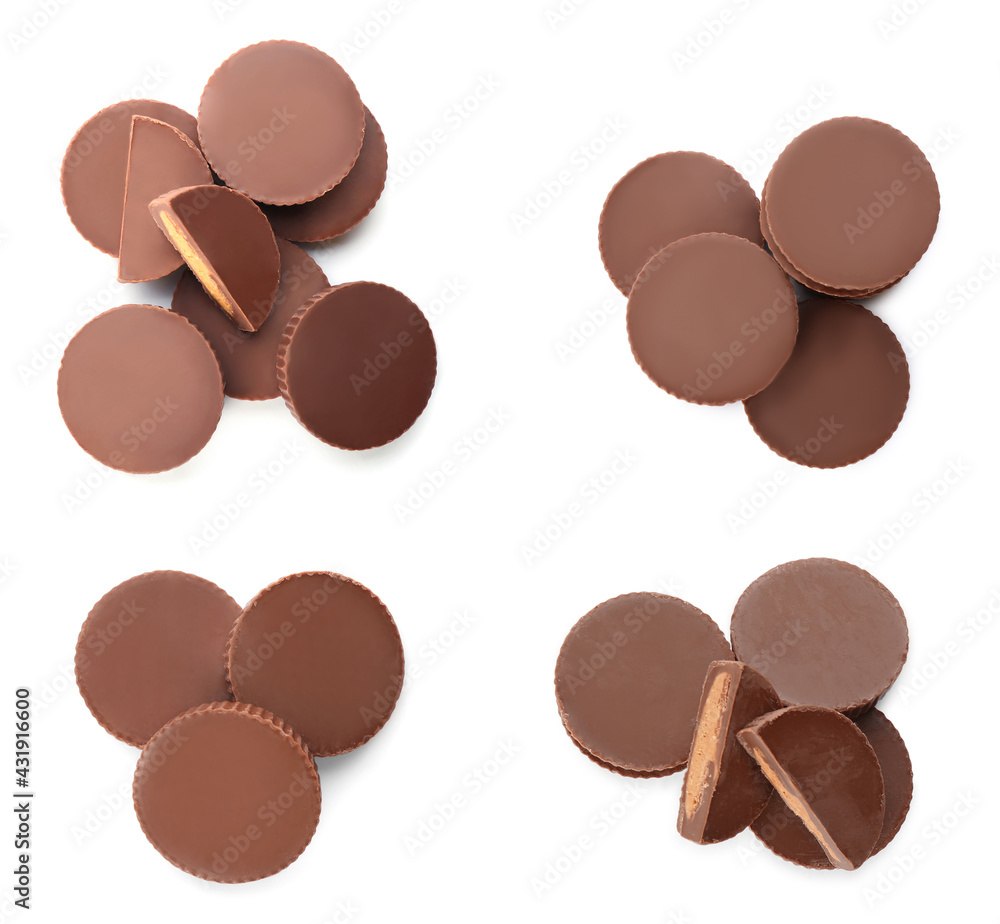 Fototapeta premium Set with delicious peanut butter cups on white background, top view
