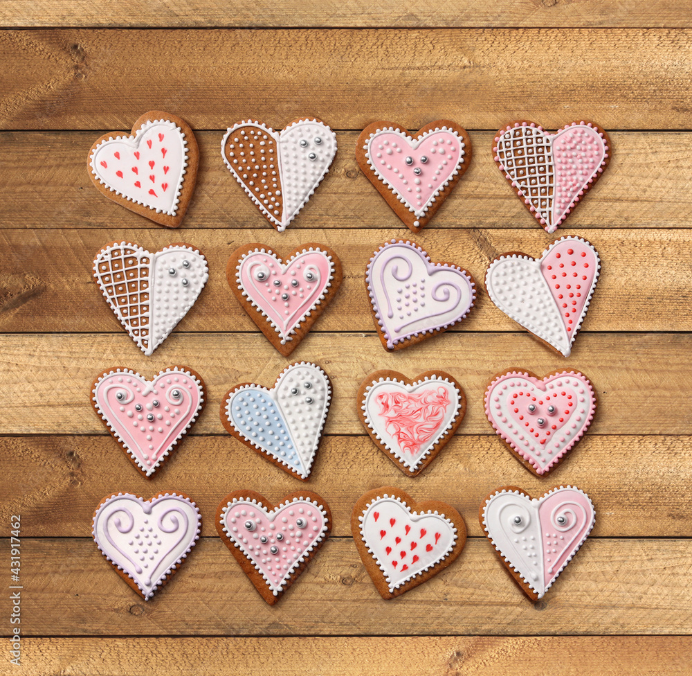 Homemade Christmas heart gingerbreads set on wooden background
