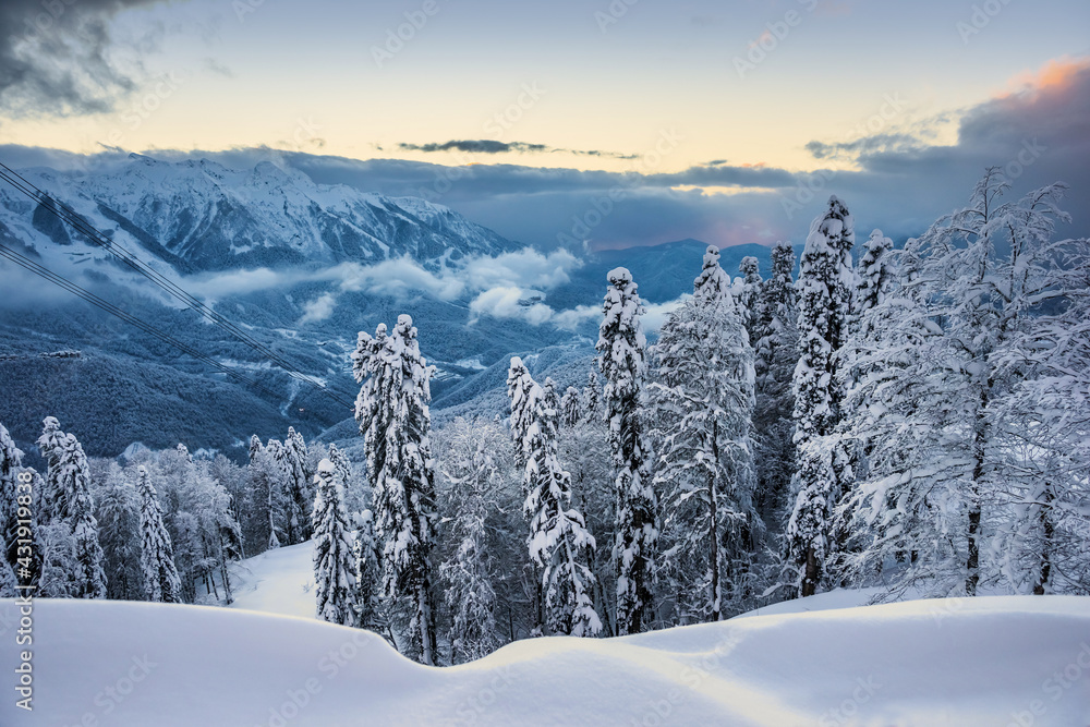 Snowy winter mountain landscape in Krasnaya Polyana. Gazprom ski resort, Sochi, Russia