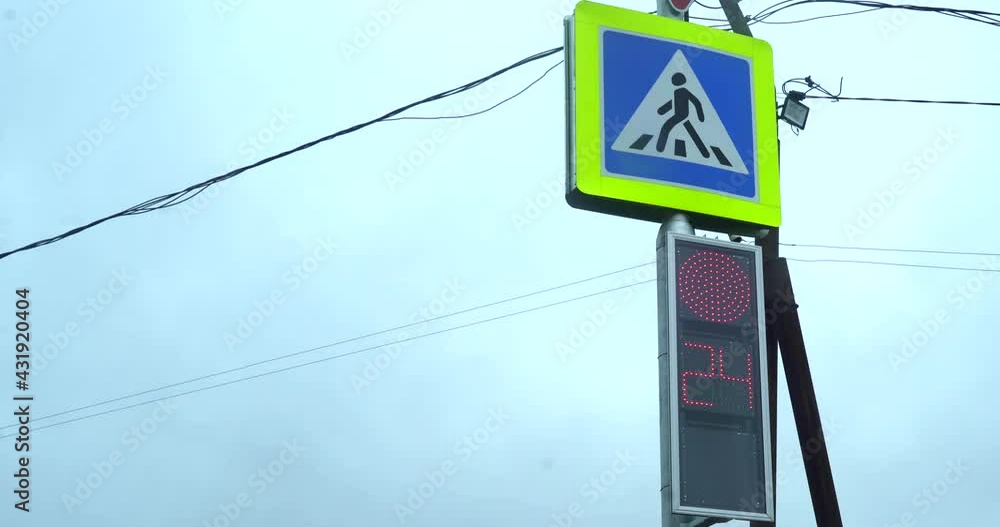 Close-up pedestrian traffic light. Two traffic lights turn red and turn green. Countdown seconds. City life real time. City streets in the daytime. Traffic lights with camera on the street from red to Close-up pedestrian traffic light. Two traffic lights turn red and turn green. Countdown seconds. City life real time. City streets in the daytime. Traffic lights with camera on the street from red to