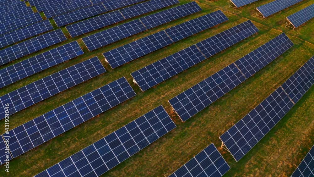 Aerial drone shot of Solar Power Station. Top view of Solar Power station. Flying from above Solar Farm with. Concept of Renewable Energy. Aerial drone shot of Solar Power Station. Top view of Solar Power station. Flying from above Solar Farm with. Concept of Renewable Energy.