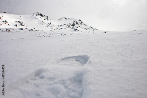 Footstep on white snow covered mountains Australia photo
