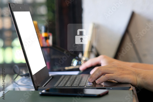 Person working on laptop computer and user typing login and password, cyber security concept, data protection and secured internet access, cybersecurity