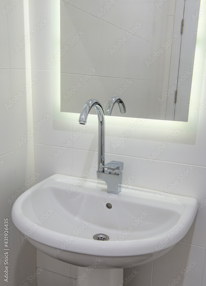 Interior design of bathroom sink in luxury apartment Interior design of bathroom sink in luxury apartment