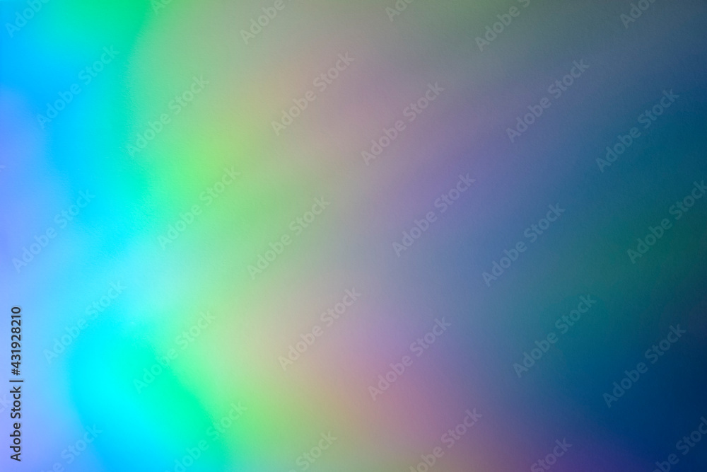 Blurred rainbow light refraction texture overlay effect for photo and mockups. Organic holographic flare on a white wall. Shadows for natural light effects Blurred rainbow light refraction texture overlay effect for photo and mockups. Organic holographic flare on a white wall. Shadows for natural light effects