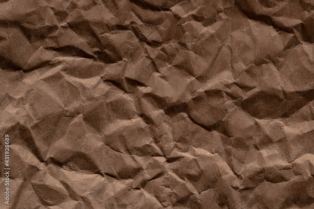 Fototapeta premium crumpled paper.sheet of brown cardboard paper. detailed high resolution texture. abstract background for wallpaper.