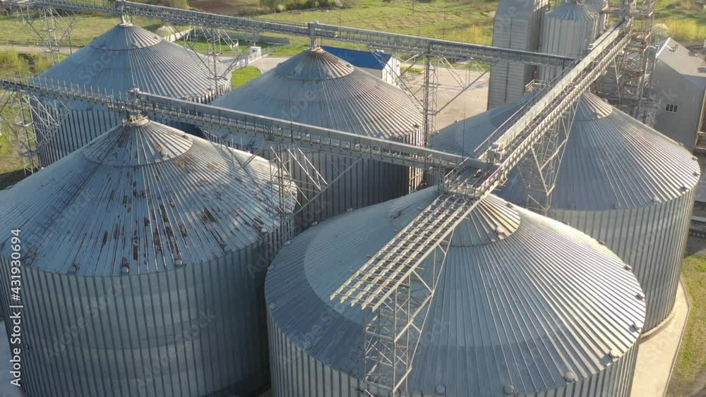 Grain elevator business with large storage bins of corn, grain, soybean