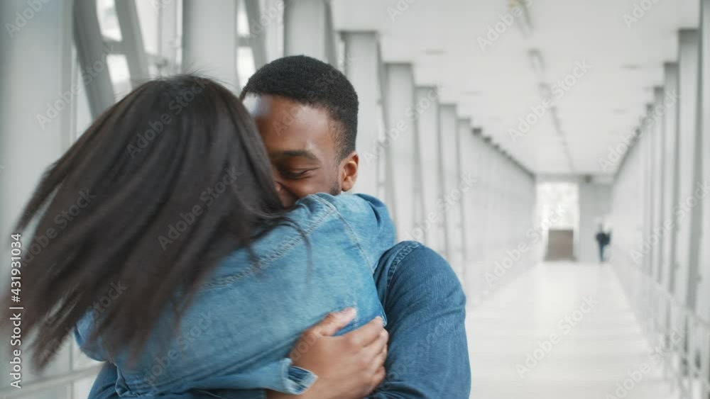 Joyful African American Couple Hugging And Spinning Meeting In Airport Joyful African American Couple Hugging And Spinning Meeting In Airport