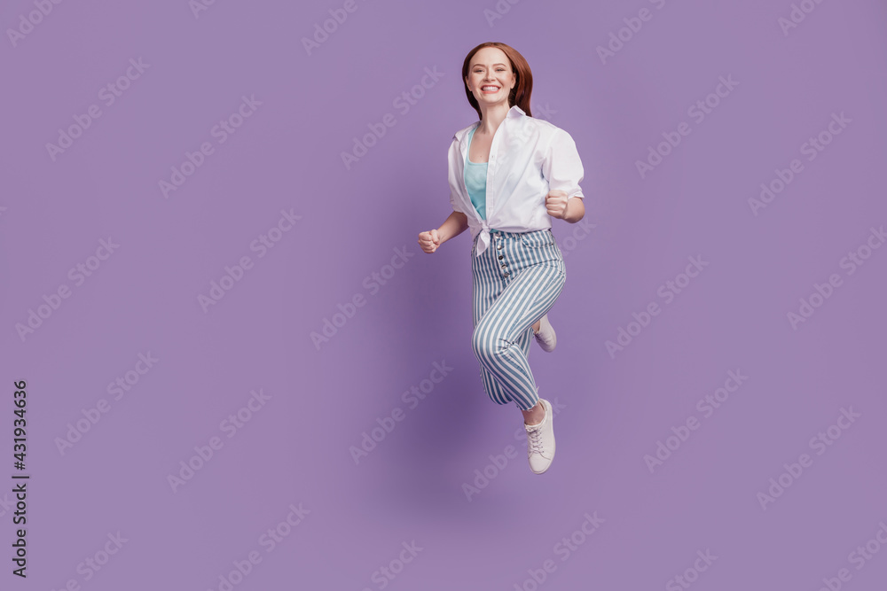 Portrait of cheerful crazy adorable lady jump run fast on violet background Portrait of cheerful crazy adorable lady jump run fast on violet background