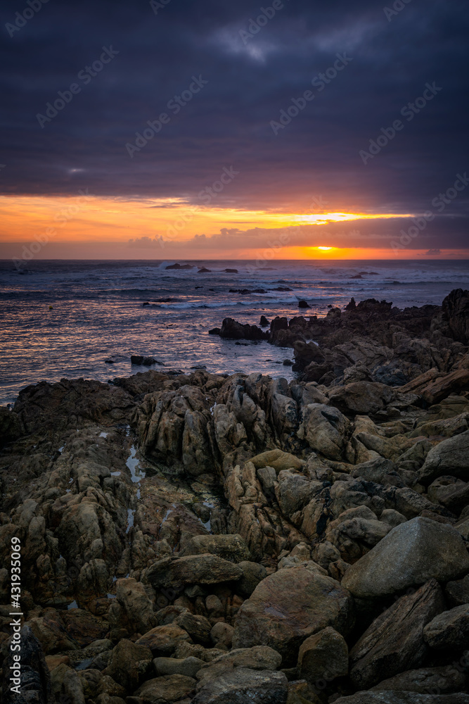 Obraz premium Beautiful sunset rock beach landscape peaceful relaxing with waves crashing atlantic ocean in Spain