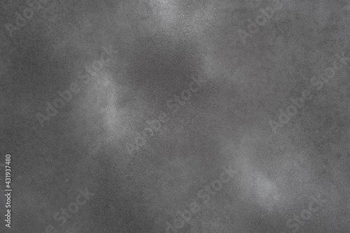 Abstract dark background,Rough surface of black spray paint on Rusty iron plate