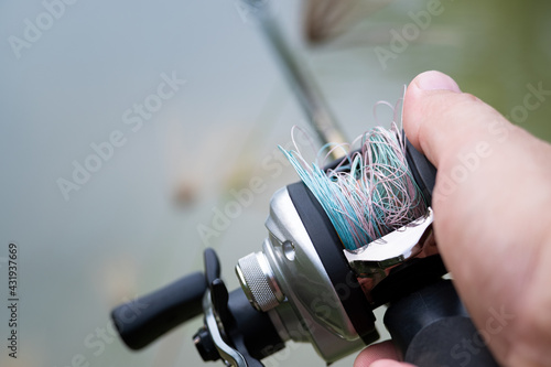 Fishing line tangled on lure Bait Casting Reel,like a Birds-nest tangles,Beginner fisherman. photo