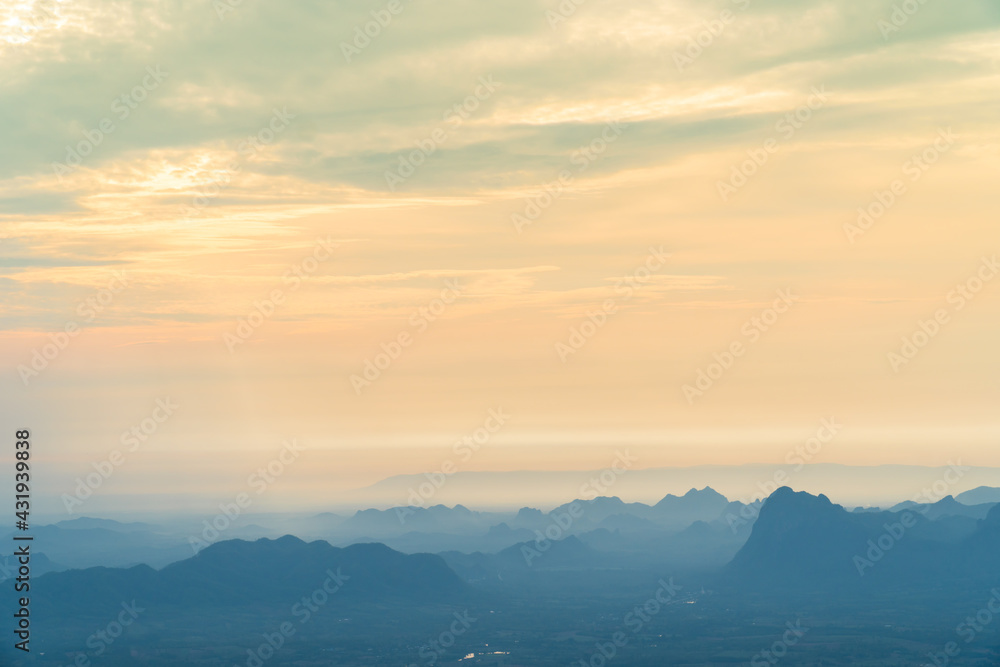 Sunrise at mountain cliff with mountain background. Nature park and outdoor landscape background