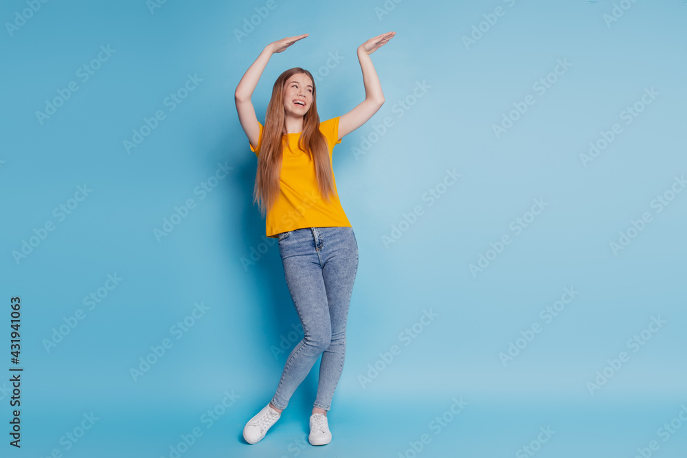 Portrait of carefree lady dance enjoy wear casual clothes on blue background Portrait of carefree lady dance enjoy wear casual clothes on blue background