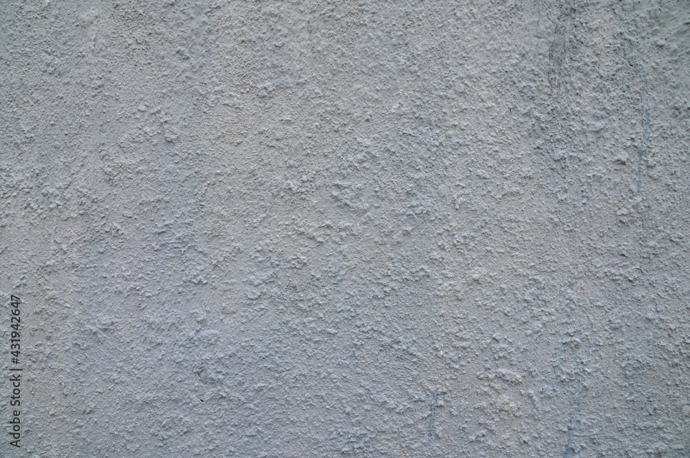 Fototapeta premium The background is made of rugged, gray-colored plaster walls.