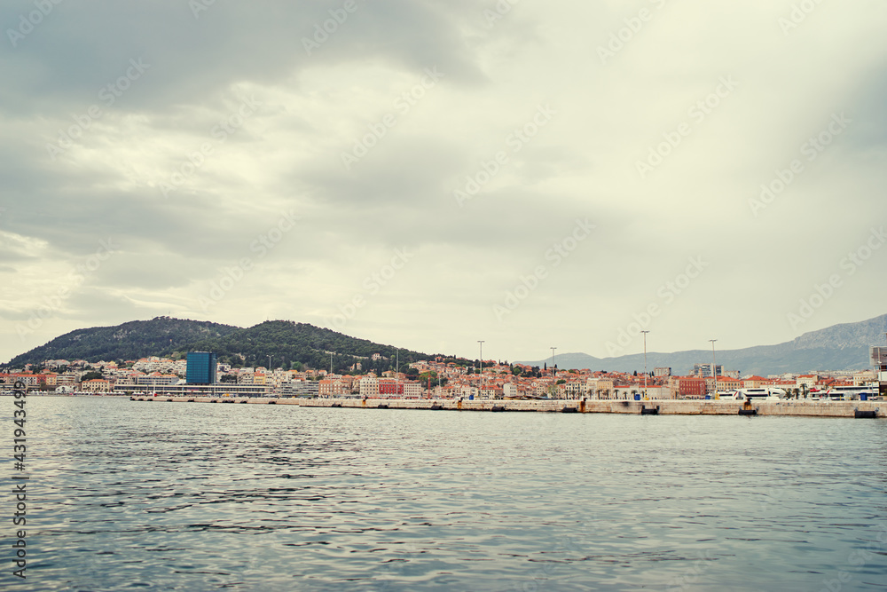 Travel by Croatia. Beautiful landscape with Split Old Town and sea promenade.
