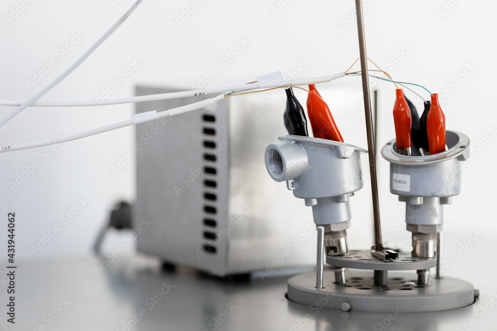 Thermocouple calibration in progress. A man tests temperature sensors