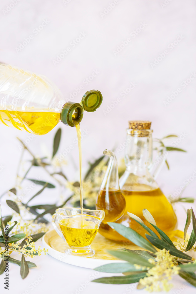 Olive branch and olive oil bottle isolated on white. Olive branch and olive oil bottle isolated on white.