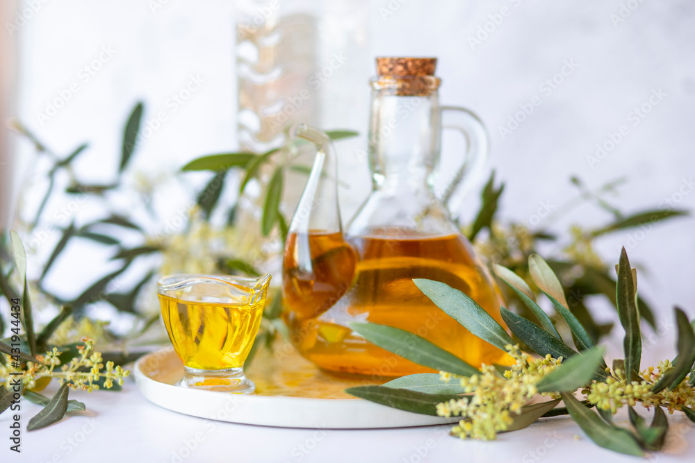 Olive branch and olive oil bottle isolated on white. Olive branch and olive oil bottle isolated on white.