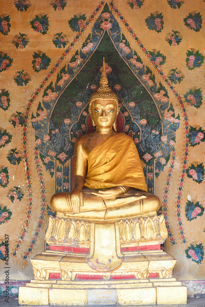 Golden buddha statue at a temple in Thailand.