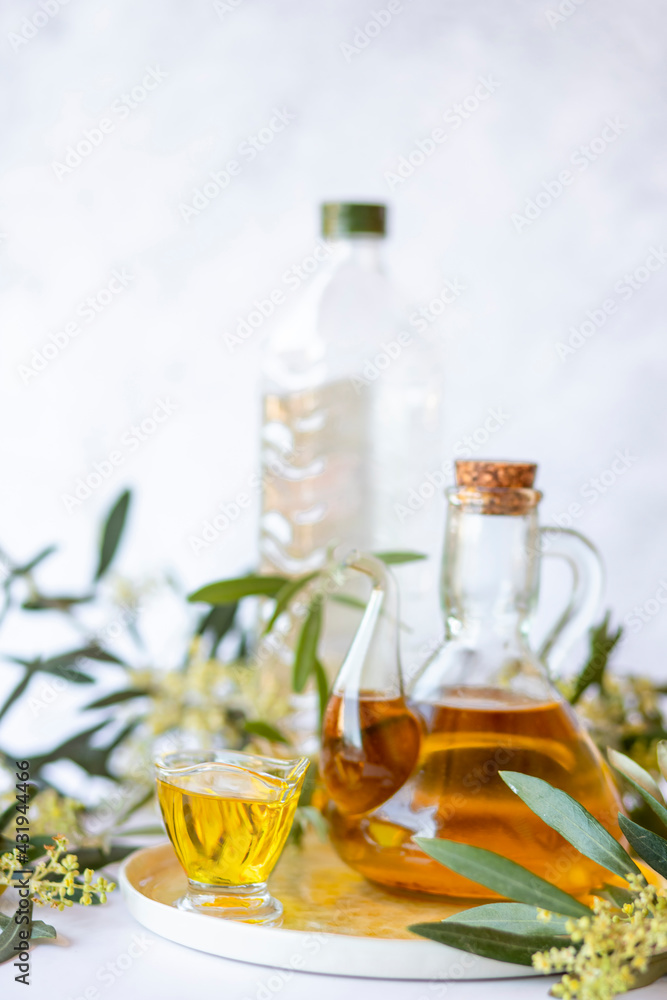 Olive branch and olive oil bottle isolated on white. Olive branch and olive oil bottle isolated on white.