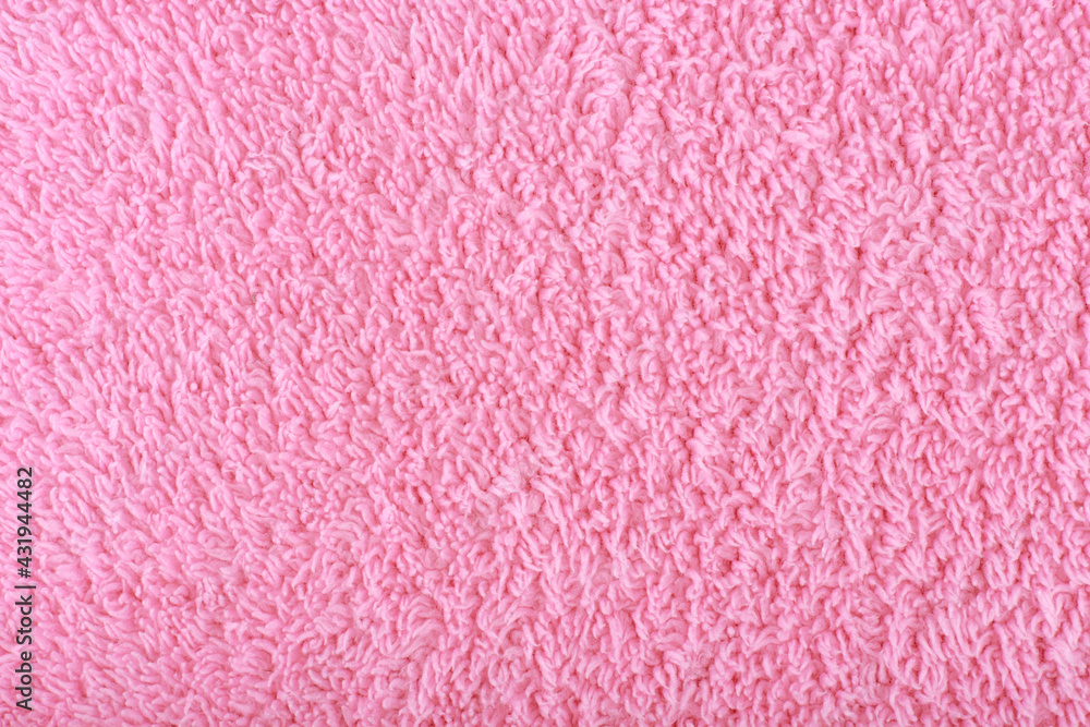 Pink fuzzy fabric close up. Fleece cozy towel background with space for text